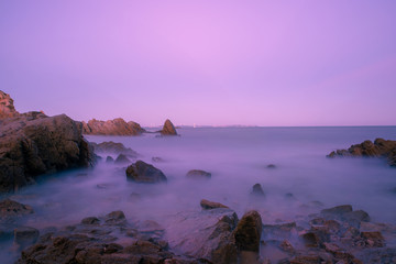 The Sea  of heads of hills, rocks singular, spray flying