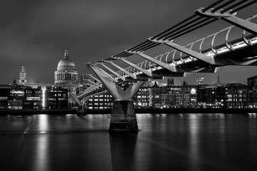 Fototapeta na wymiar St Paul's Cathedral along the length of Millennium Bridge, Black and White