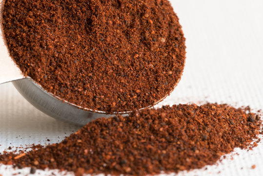 Chili Powder Spilled from a Teaspoon