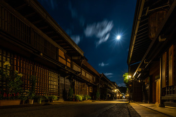 Naklejka na ściany i meble Night view of Sannomachi Street in Takayama, with old wooden buildings and houses dating from the Edo Period, Japan