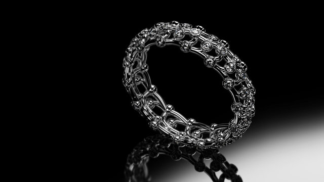 Standing openwork platinum Band Ring with diamonds isolated on a black background. 3D rendering
