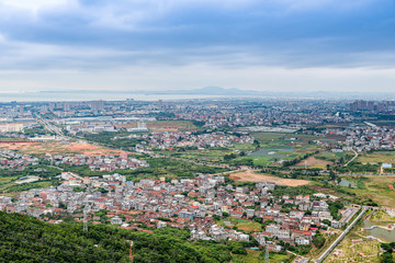 Fototapeta na wymiar The town below the mountain is seen from the mountain