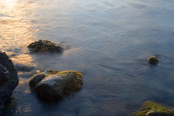 closeup stones in a sea near a coast