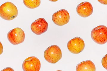 Fresh red and yellow apples on white isolated background.