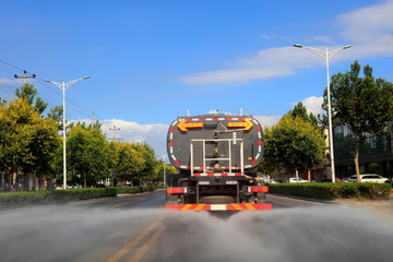 The sprinkler is on the highway.
