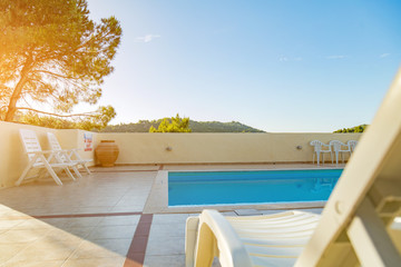 Tropical swimming pool on a nice hot day.
