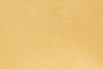 Light yellow smooth natural leather with medium grain textured background
