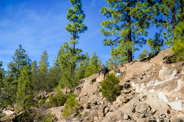 couple of people hiking in a beautiful mountain setting