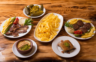 assorted turkish kebabs on wooden table