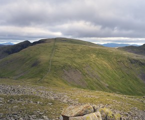 Fototapeta premium The long dry stone wall upto Scoat fell