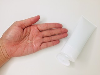 Woman’s hand using alcohol gel to antiviruses