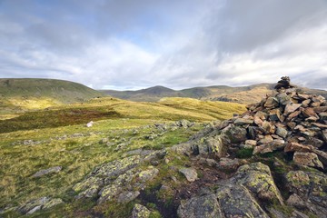 Fototapeta na wymiar Larege stone cairn on Middle Fell
