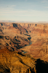 River cutting through the Grand Canyon at sunset