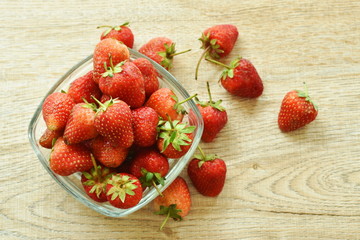 fresh strawberry in glass bowl on table