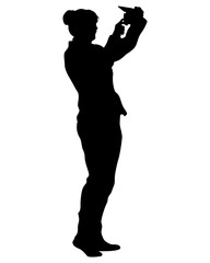 Young woman holds a smartphone in her hand. Isolated silhouettes of people on a white background