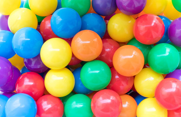 Many colorful plastic balls in a playground.
