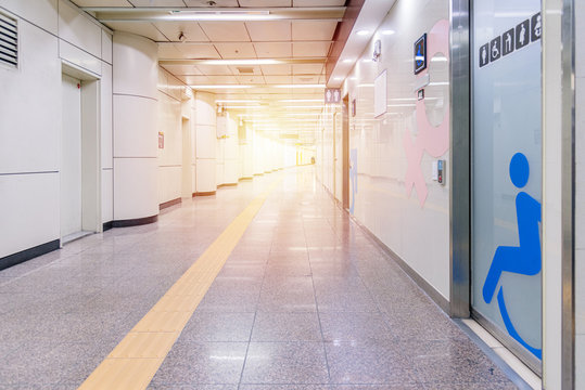 Walkway and many rooms to toilet, Perspective Long corridor with yellow color line
