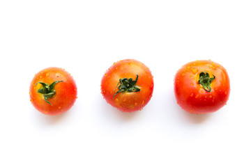 Fresh red Tomato with water drops on white background.