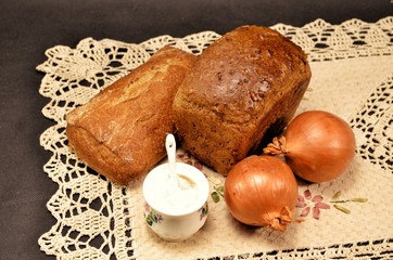 bread and wheat on wooden table