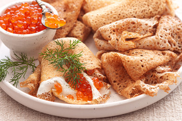 Traditional Russian pancakes with red caviar.Holiday Carnival Maslenitsa Shrovetide