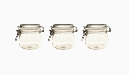 Three jars on white background. studio image of kitchen glassware