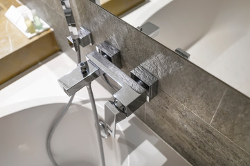 Bathtube pipe in luxury bathroom.