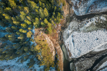 Aerial view of river and forest in Tatras in winter