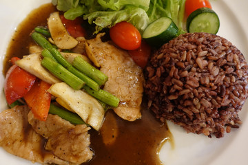 Rice, Berry, Baked pork, Salad with vegetables and sauce
