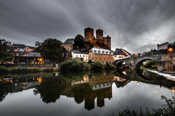 Fototapeta na wymiar runkel Germany, right on the beautiful river Lahn. with a weir great reflection and long exposure. everything in the evening at sunset and with a great castle ruin