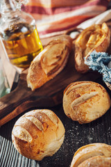 Wood table with breads and vegetal oil