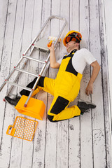 Fototapeta premium Construction accident. Fall from a ladder.