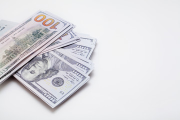 Dollars on a white background, with space for text, with copy space. Concept backgrounds for financial topics, savings and salary.