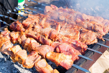 Cooking barbecue dish named shashlyk on skewers close