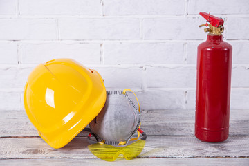 A protective helmet and dust mask is necessary on any construction site.