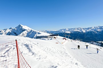  vacationers on a plateau of a ski resort during sunset
