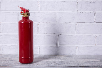 A fire extinguisher is a preventive measure necessary in areas of fire.
