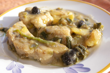 stewed cod with onion and olives