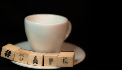 Colombian coffee cup on beans and dark background