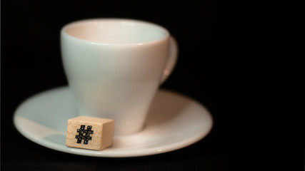 Colombian coffee cup on beans and dark background