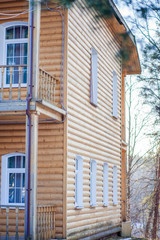 wooden house on the background of coniferous forest