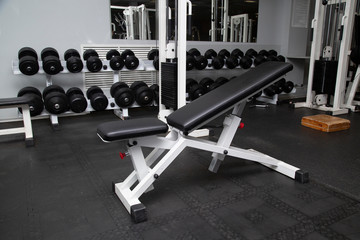 Fototapeta na wymiar Gym equipment and dumbbells for fitness classes in the gym.