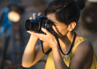 Portrait of female with camera