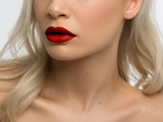 Sexual full lips. Red gloss of lips and woman's skin. The mouth is closed. Increase in lips, cosmetology. red lipstick. Open mouth and with teeth. blonde hair.