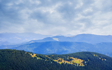 Carpathian mountain ranges in cloudy rainy weather_