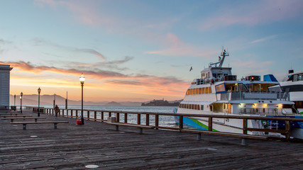 Docked Ferry Against Sunset At San Francisco Pier