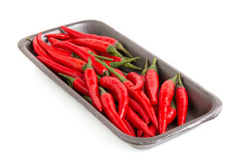 red chili pepper in black box isolated on white background