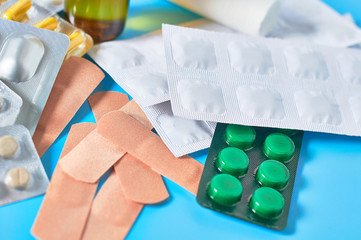 Different medicaments for disease treatment on blue background. Medical concept