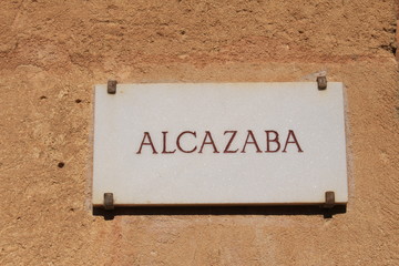"Alcazaba" written marble board. Alcazaba is a palatial fortification at Alhambra Palace complex.