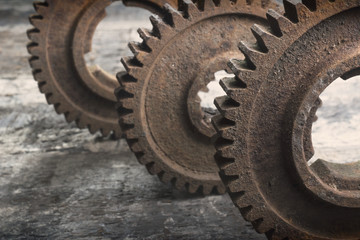Rusty gears from old mechanism photographed at close range.