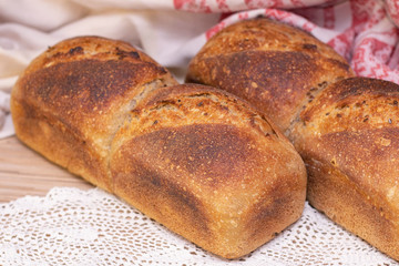 Bakery - golden rustic bread crusts. Fresh aromatic bread on the table. Food concept.